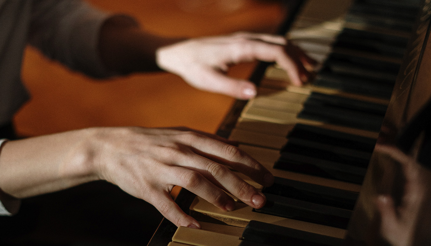 Closeup of someone playing piano
