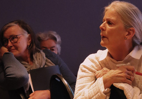 Three women from Our Neighbourhood group sitting listening at dlr Mill Theatre